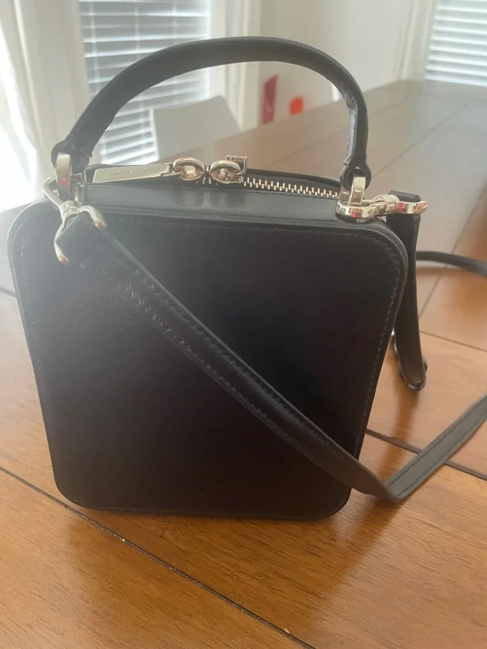Kate Spade New York Daisy Vanity Crossbody Bag with front pocket and handle